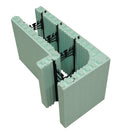 Blocs de construction en polystyrène expansé, de couleur verte, avec des connecteurs en plastique noir, montrant une section coupée.