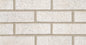 Mur en briques de couleur neutre avec des textures granuleuses, disposées en rangées.