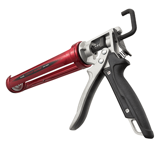 Pistolet à calfeutrage rouge et noir avec poignée ergonomique et mécanisme de déclenchement.