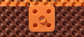 Dispositif de fixation à crampons multiples DELTA-FAST'ner, couleur orange, conçu pour fixer les membranes DELTA aux murs de fondation.