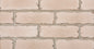 Mur en briques de couleur rose clair avec des joints gris, texture lisse et uniforme.
