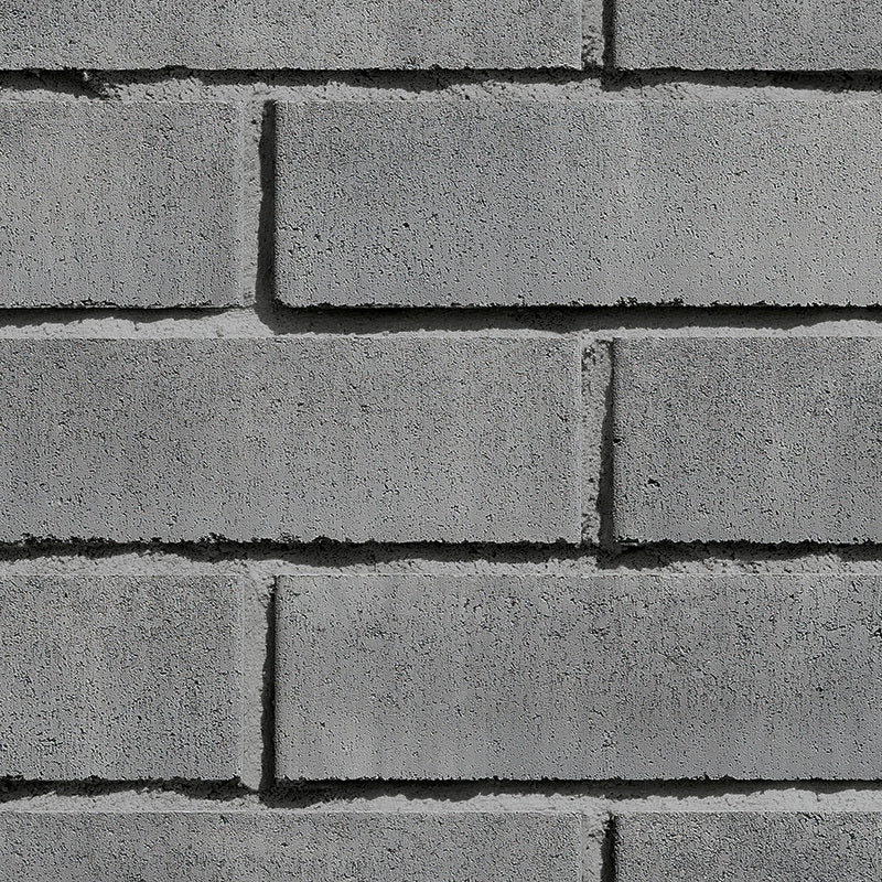 Brique de béton classique Romania pour revêtements de façade, couleur grise et texture rugueuse.