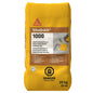 Mortier de réparation SikaQuick 1000, sac jaune de 25 kg, avec avertissement de danger, pour durcissement rapide.