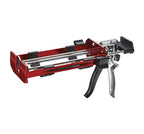 Pistolet à calfeutrer rouge et argent, avec un mécanisme de déclenchement et un support pour cartouche.
