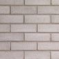Brique Melville Slik® grise avec une surface lisse et des arêtes vives.