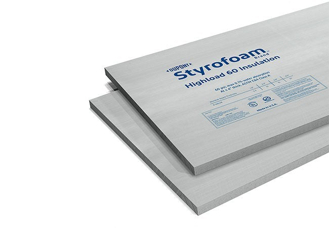 Panneaux d'isolation en polystyrène extrudé DuPont™ Styrofoam™ Highload 60, couleur gris clair, empilés avec étiquettes visibles.
